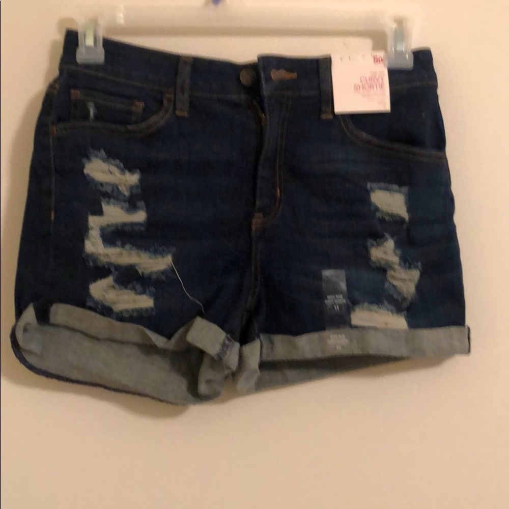 Ripped blue jean shorts